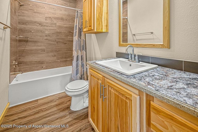 118 Highland Dr, Craig, CO 81625 - full bath with shower / bath combination with curtain, vanity, wood finished floors, and a textured wall