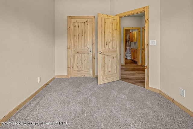 118 Highland Dr, Craig, CO 81625 - unfurnished bedroom with carpet and baseboards