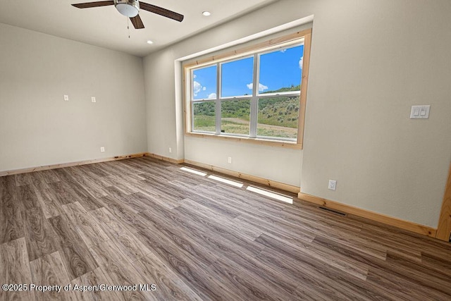 118 Highland Dr, Craig, CO 81625 - unfurnished room featuring a ceiling fan, wood finished floors, and recessed lighting