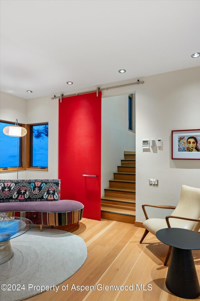 stairway featuring hardwood / wood-style floors