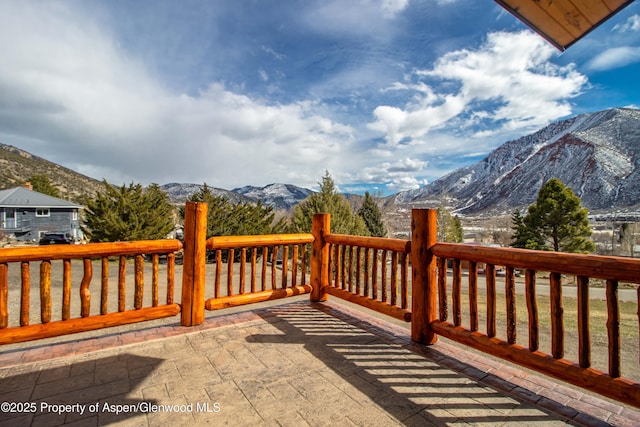 wooden deck featuring a mountain view