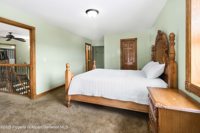 bedroom featuring carpet floors and baseboards