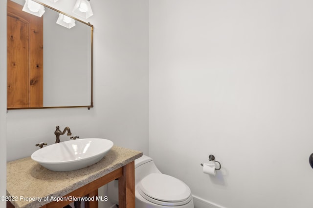 2908 Juniper Hill Dr, Aspen, CO 81611 - half bathroom featuring a sink and toilet