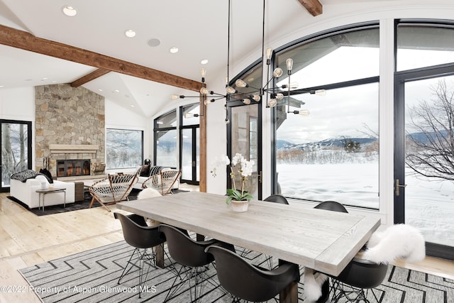 2908 Juniper Hill Dr, Aspen, CO 81611 - dining space featuring wood finished floors, a mountain view, recessed lighting, and a stone fireplace