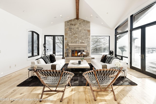 2908 Juniper Hill Dr, Aspen, CO 81611 - living area with french doors, light wood finished floors, beamed ceiling, a fireplace, and recessed lighting