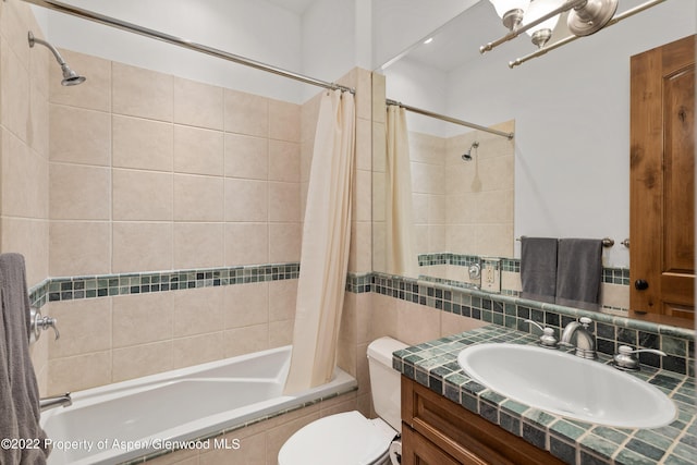 2908 Juniper Hill Dr, Aspen, CO 81611 - full bathroom featuring tiled shower / bath, vanity, tile walls, and a chandelier