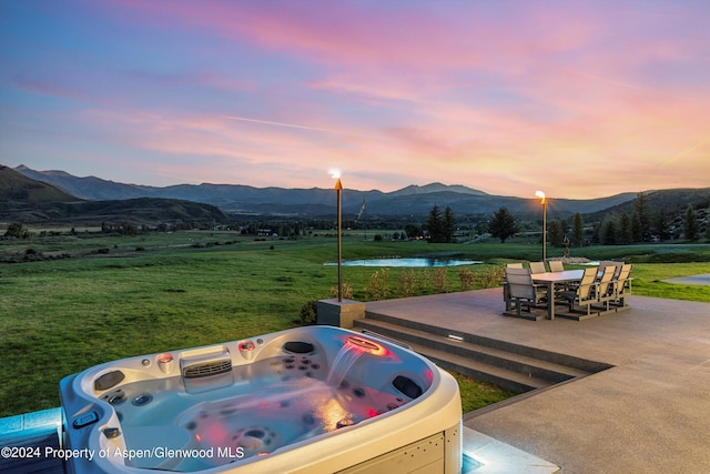 6890 E Sopris Creek Rd, Snowmass, CO 81654 - view of patio featuring a water and mountain view and a hot tub