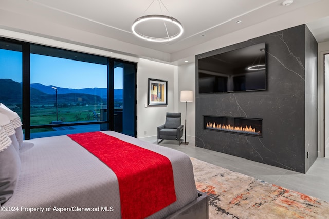6890 E Sopris Creek Rd, Snowmass, CO 81654 - bedroom featuring a fireplace