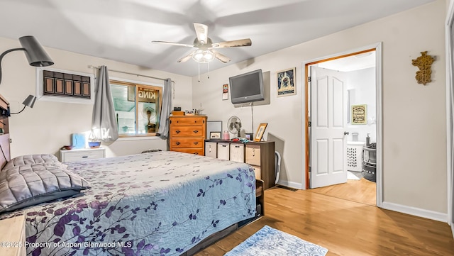 600 Rose St, Craig, CO 81625 - bedroom with wood finished floors, baseboards, and a ceiling fan