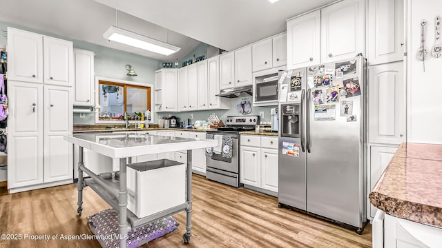 600 Rose St, Craig, CO 81625 - kitchen featuring appliances with stainless steel finishes, white cabinetry, and light wood-style floors