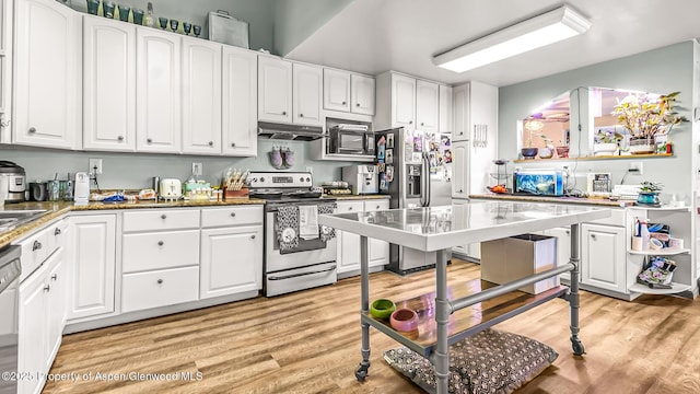 600 Rose St, Craig, CO 81625 - kitchen featuring stainless steel appliances, under cabinet range hood, white cabinets, and light wood-style flooring