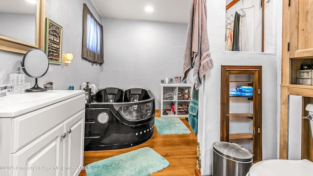 600 Rose St, Craig, CO 81625 - bathroom featuring vanity, wood finished floors, and recessed lighting