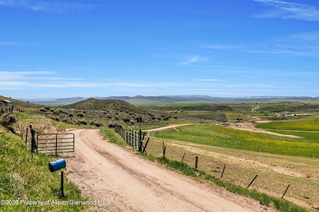 40889 County Road 76a, Hayden, CO 81639 - view of street with a view of rural / pastoral area, a mountain view, and a gated entry