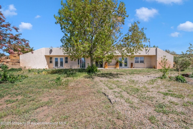 40889 County Road 76a, Hayden, CO 81639 - rear view of property with french doors and stucco siding