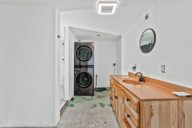 40889 County Road 76a, Hayden, CO 81639 - bathroom with stacked washer and clothes dryer and vanity