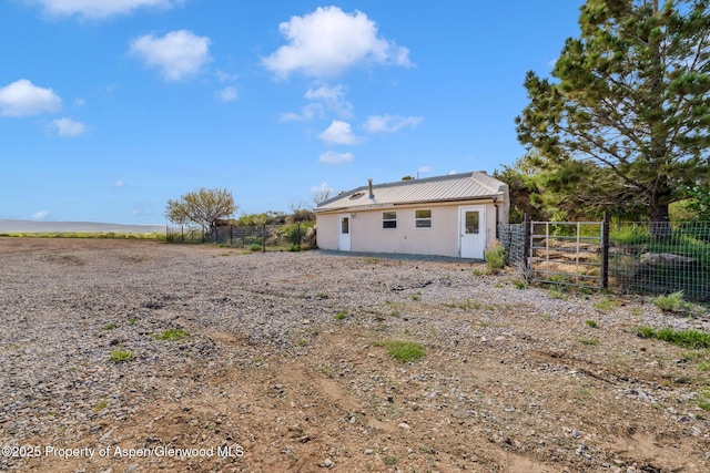 40889 County Road 76a, Hayden, CO 81639 - back of house featuring metal roof and stucco siding