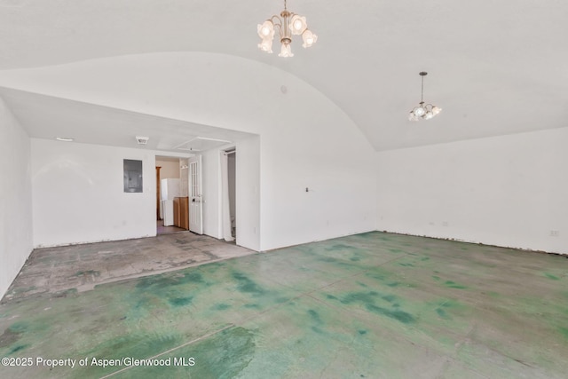 40889 County Road 76a, Hayden, CO 81639 - unfurnished living room featuring a chandelier, vaulted ceiling, electric panel, and carpet flooring
