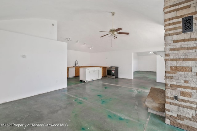 40889 County Road 76a, Hayden, CO 81639 - unfurnished living room featuring finished concrete floors, a high ceiling, a sink, and ceiling fan