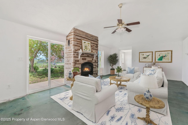 40889 County Road 76a, Hayden, CO 81639 - living room featuring concrete floors, ceiling fan, a large fireplace, and vaulted ceiling