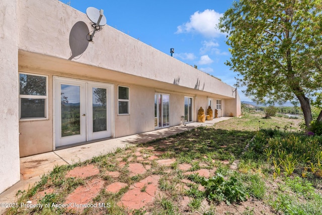40889 County Road 76a, Hayden, CO 81639 - back of property featuring french doors, stucco siding, and a patio area