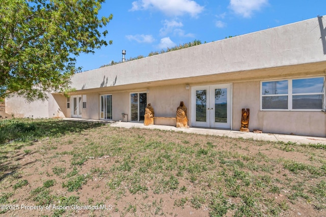 40889 County Road 76a, Hayden, CO 81639 - back of property featuring french doors and stucco siding