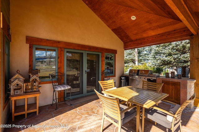 view of patio featuring grilling area, outdoor dining area, and area for grilling