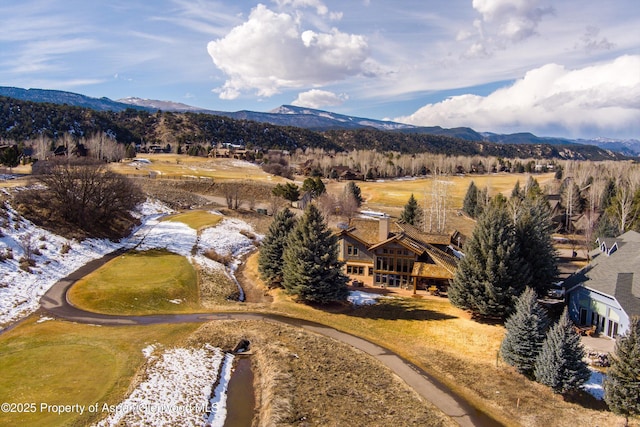 drone / aerial view featuring a mountain view