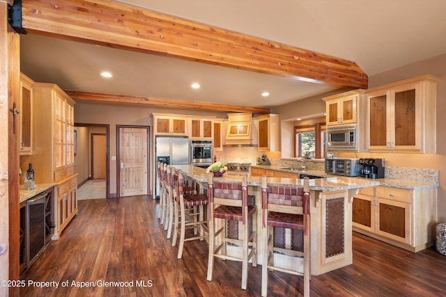 kitchen featuring dark wood-style flooring, appliances with stainless steel finishes, beamed ceiling, and glass insert cabinets