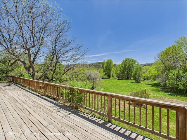 deck featuring a yard