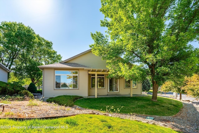 55 Limberpine Cir, Battlement Mesa, CO 81635 - back of property featuring a lawn