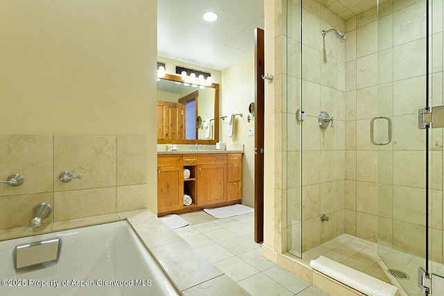 bathroom featuring tile patterned flooring, vanity, and an enclosed shower