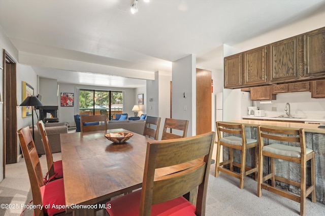 1024 E Hopkins Ave # 16, Aspen, CO 81611 - dining space featuring light carpet