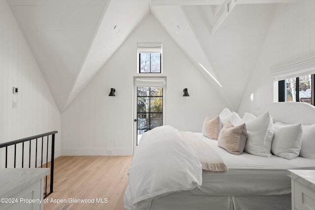 bedroom with access to outside and light hardwood / wood-style flooring