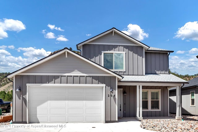 view of front of property featuring a porch and a garage