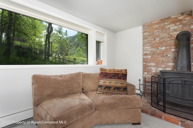 carpeted living room featuring a baseboard radiator