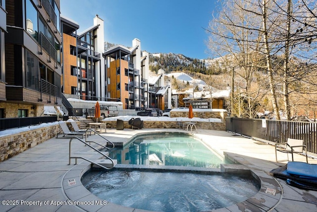 800 S Mill St Unit 304D, Aspen, CO 81611 - pool featuring a community hot tub, a mountain view, and a patio