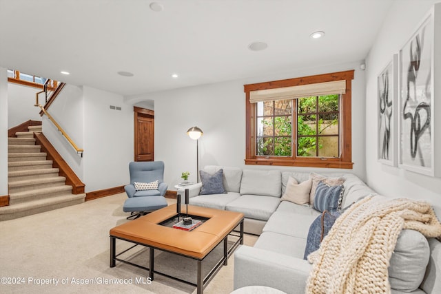 living room featuring light carpet