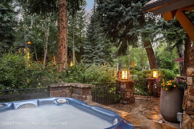 view of patio / terrace with a hot tub