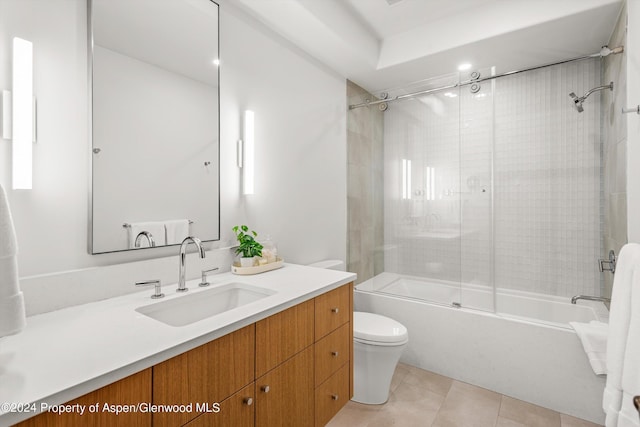 full bathroom with toilet, vanity, tile patterned flooring, and shower / bath combination with glass door