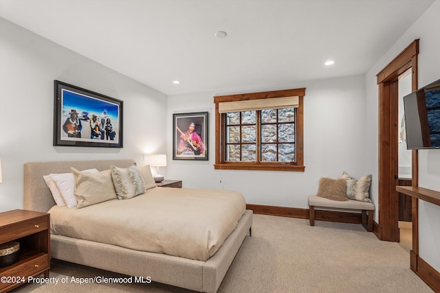 bedroom with light colored carpet