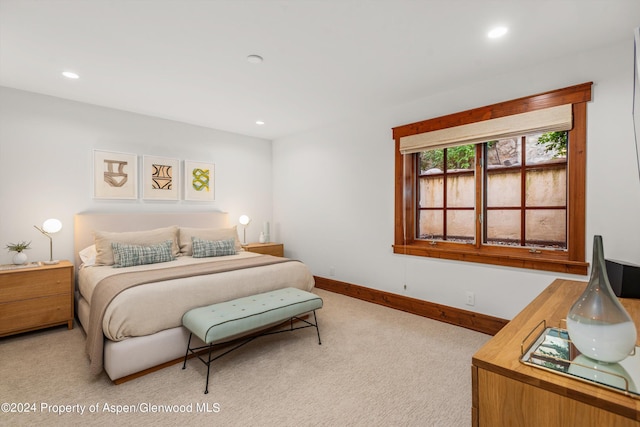 bedroom with light colored carpet