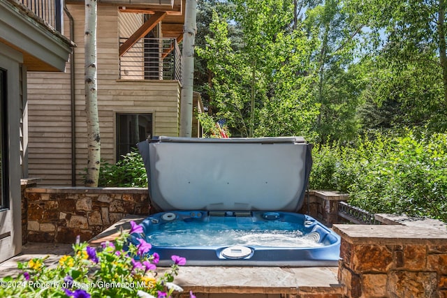 exterior details with a hot tub