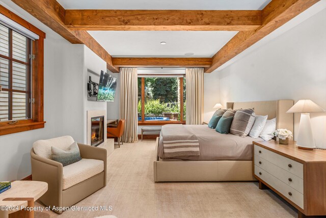 bedroom featuring light carpet