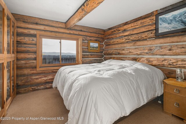 3714 Bear Ridge Rd, Basalt, CO 81621 - carpeted bedroom with rustic walls and beamed ceiling