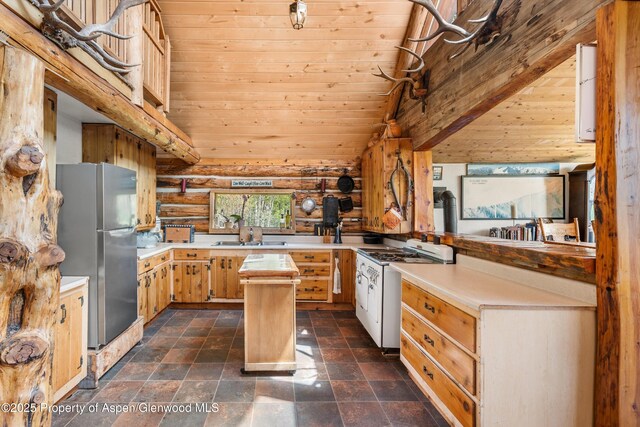 3714 Bear Ridge Rd, Basalt, CO 81621 - kitchen featuring freestanding refrigerator, white gas range oven, wooden ceiling, light countertops, and log walls