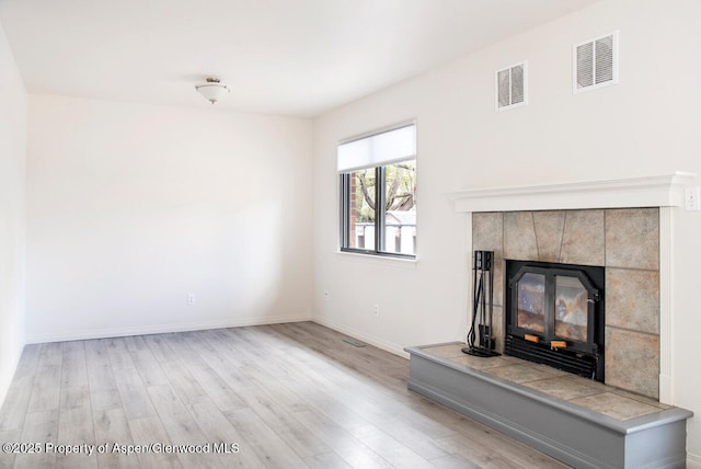 681 S 2nd St Unit A, Carbondale, CO 81623 - unfurnished living room with baseboards, wood finished floors, and visible vents