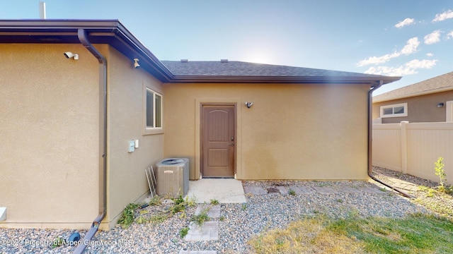 entrance to property featuring central AC