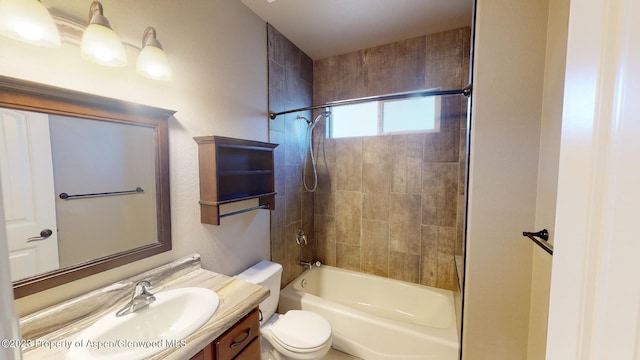 full bathroom with vanity, toilet, and tiled shower / bath