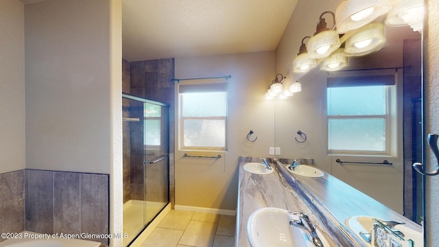 bathroom featuring tile patterned flooring, plenty of natural light, and walk in shower