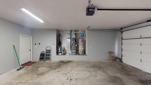 garage with a garage door opener and water heater